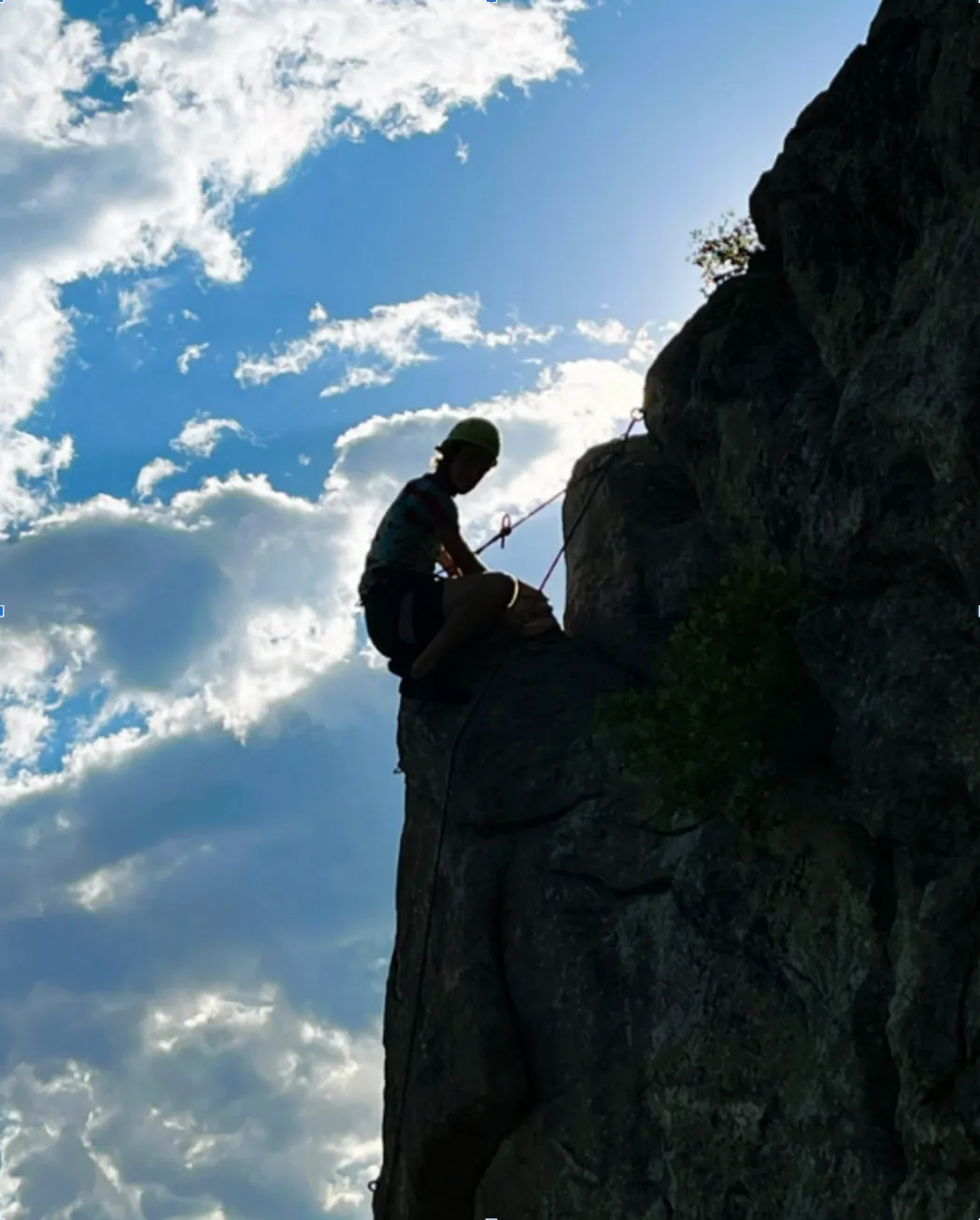 Matt's son completing the crux of a climbing route.