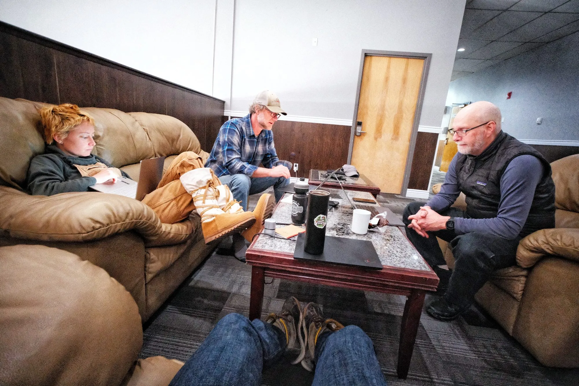 Matt, Von, and Cat work out the details of the problems to be solved in the lounge