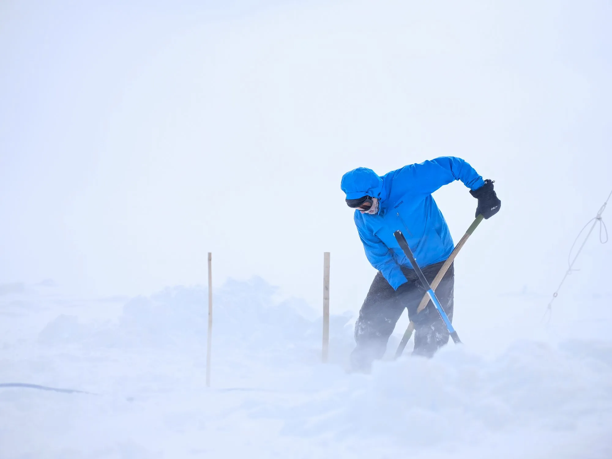 Von Walden, the author of this blog, shovels snow for anchoring the solar panels during a wind storm